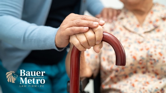 woman helping an elderly woman or family member
